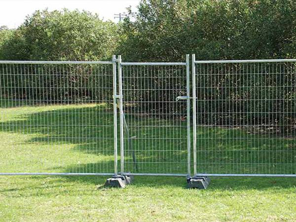 Australia temporary fence with a single swing gate installed around the green land.