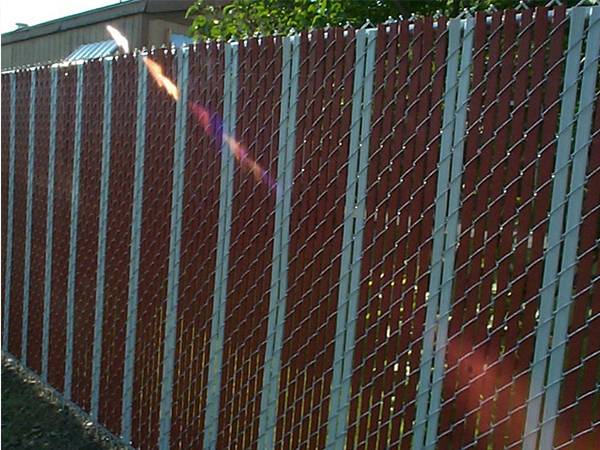 Chain Link Fence With Slats For Privacy Protection And Sound Barrier