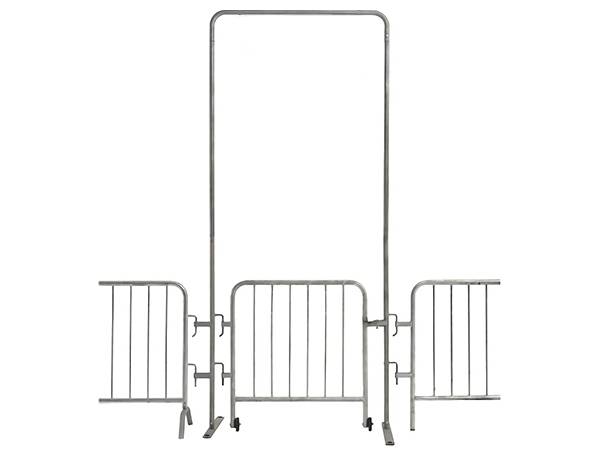 A steel barricade pedestrian gate is connected with two barriers.