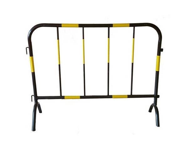 A black steel barricade is fastened with yellow reflective stripe.