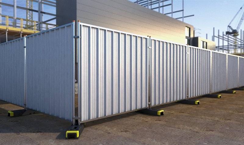 Hoarding panel system with galvanized frame and rubber feet on ground.